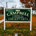 Post and Panel with green background and cream lettering for Campbell Carpet in Cortland Ohio