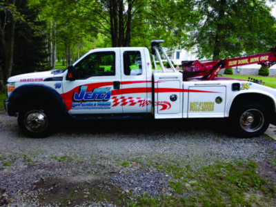 Digitally printed vehicle decals installed on a tow truck